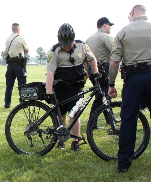 Officer with Bike and other officers around him